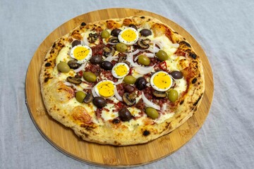 Original Brazilian pizza with olives, mushrooms, grated pepperoni, onion, red pepper, oregano and extra virgin olive oil