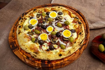 Original Brazilian pizza with olives, mushrooms, grated pepperoni, onion, red pepper, oregano and...