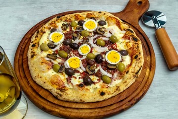 Original Brazilian pizza with olives, mushrooms, grated pepperoni, onion, red pepper, oregano and extra virgin olive oil
