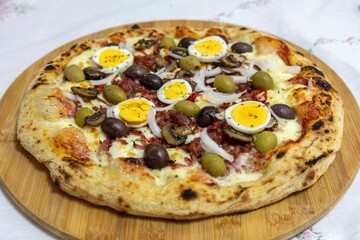 Original Brazilian pizza with olives, mushrooms, grated pepperoni, onion, red pepper, oregano and extra virgin olive oil