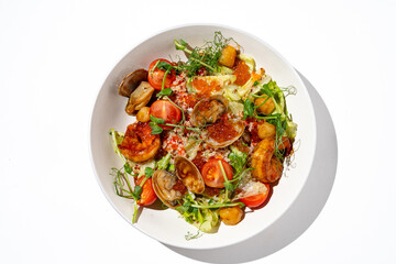 Colorful assortment of fresh seafood salad is beautifully arranged in a stylish bowl. Sunlight illuminates the ingredients, highlighting juicy tomatoes, tender clams, and delicate greens