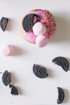 donuts with crushed cookies, marshmallow on a white background