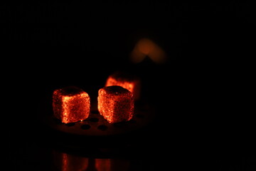 Glowing coals with glitch style lighting, enriched by noise, effect and grain details, create a...