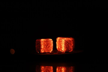 Glowing coals with glitch style lighting, enriched by noise, effect and grain details, create a...