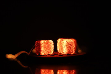 Glowing coals with glitch style lighting, enriched by noise, effect and grain details, create a...