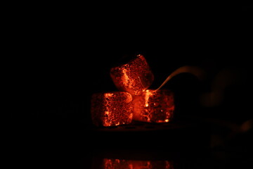 Glowing coals with glitch style lighting, enriched by noise, effect and grain details, create a...