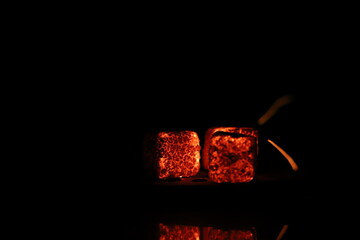 Glowing coals with glitch style lighting, enriched by noise, effect and grain details, create a...