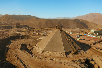 Primary Crusher System in Large-Scale Mining – Dump Trucks and Stockpile Area in the Atacama Desert   © Jorge