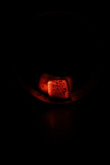 Glowing coals with glitch style lighting, enriched by noise, effect and grain details, create a...