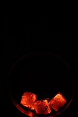 Glowing coals with glitch style lighting, enriched by noise, effect and grain details, create a mystical atmosphere in the dark. A vivid sense of heat and depth surrounds the image