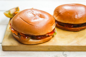 hamburgers on a wooden table