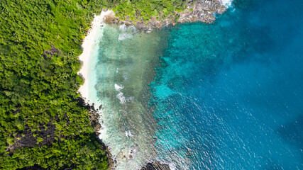 Serene beach with clear waters and rocky edges. Seychelles, Mahe.