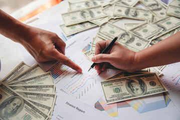 Hand holding money dollar bank note in wallet give financial payment. Man hands showing spread 100...