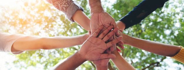 Banner diversity solidarity team multiethnic Partners hands together teamwork. Group of multiracial...
