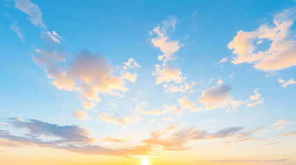 Fototapeta premium A serene sky filled with fluffy clouds and a warm sunset, creating a peaceful atmosphere.