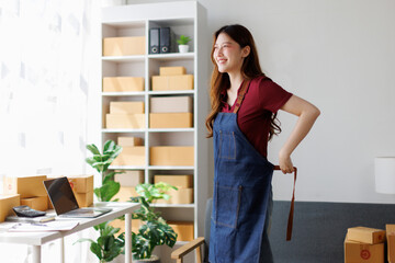 Startup small business sme entrepreneur or freelance Asian woman using a laptop with box, Young...