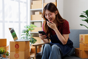 Young asia Small and Medium Enterprises (SMEs) seller woman happy work on laptop busy cellphone...