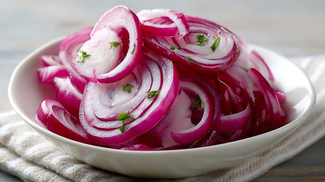 Sliced Red Onions in a White Bowl Garnished with Herbs