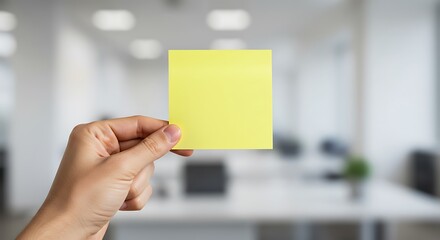Realistic Hand Holding Yellow Sticky Note – Message or Reminder Concept