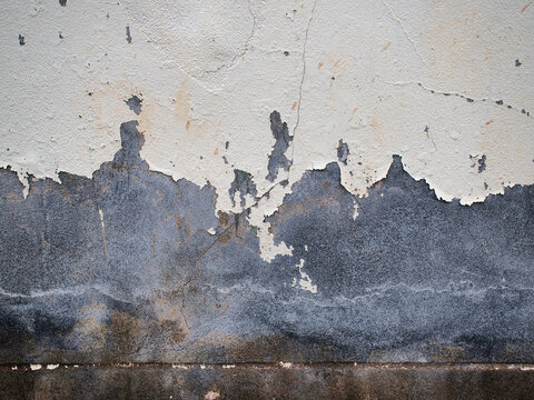 Cement wall surface with peeling paint