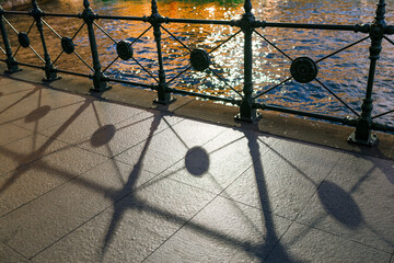 Shadows of fence on street at Circular Quay