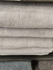 Rows of gray towels in a supermarket,Filas de toallas de color gris  en un supermercado, (16).