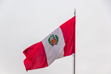 Peruvian flag on foggy day, Peru Square - Lima, Peru