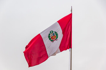 Peruvian flag on foggy day, Peru Square - Lima, Peru