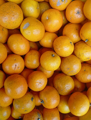 stunning close-up shot of a number of fresh, ripe oranges, showing off their bright color and textured skin, perfect for healthy eating