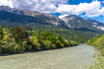 Stunning view of Nordkette massif including Seegrubenspitze peak and Hafelekarspitze peak from Innsbruck at Inn River side in spring on a sunny day, Innsbruck, Tyrol, Austria