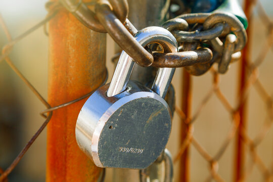 Close up of padlock on gate