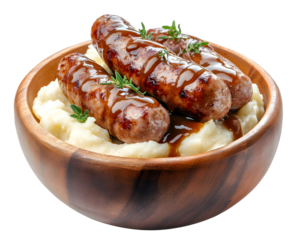 Bangers and mash with grilled sausages on creamy mashed potatoes and rich brown gravy in wooden bowl isolated on transparent background
