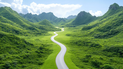 Fototapeta premium A serene view of winding road through lush green mountains under a clear blue sky, perfect for nature lovers and travel enthusiasts.