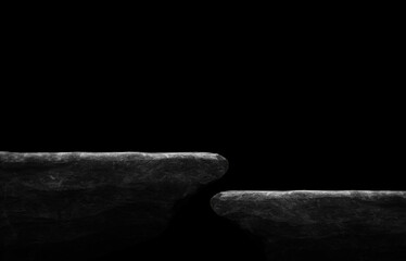 Stone podium on dark black background.