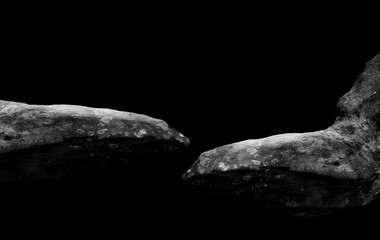Stone podium on dark black background.