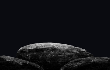 Stone podium on dark black background.