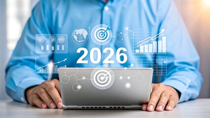 Businessman using laptop with futuristic digital data graphics and 2026 analytics overlay
