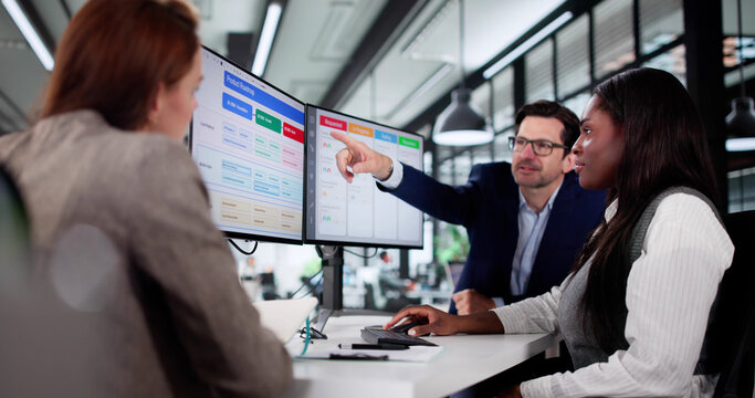 Multiracial Manager Uses Kanban Software On Laptop