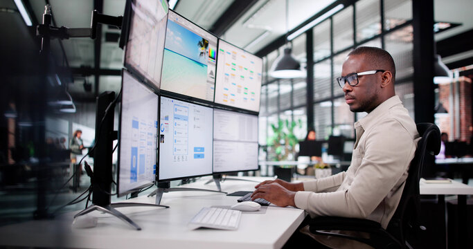 Young African American Graphic Designer Creating Interface