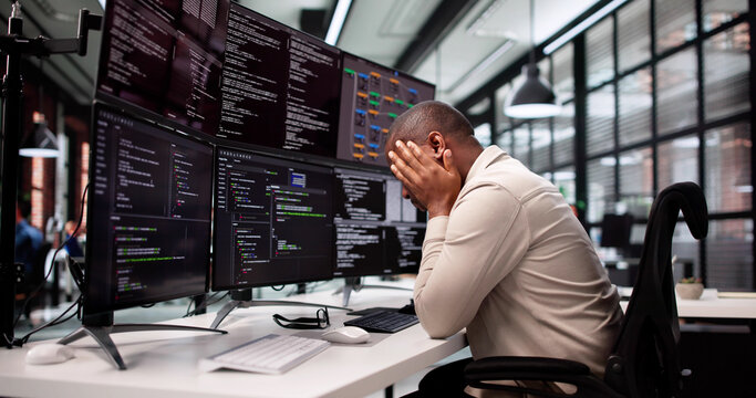 Unhappy Programmer Caught In Maze Of Broken Software