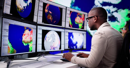 Fototapeta na wymiar Meteorologists Analyzing Climate Change Consequences On Weather Map