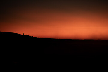 Volcanic ledge, tiny distant soul - 2