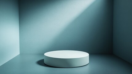 Empty, light gray pedestal in a corner room.