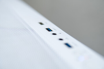 Minimalist close-up photograph of white computer case ports technology background for tech blogs...