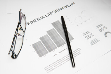 Business report analysis photograph with data charts office stationery for corporate visuals blog...