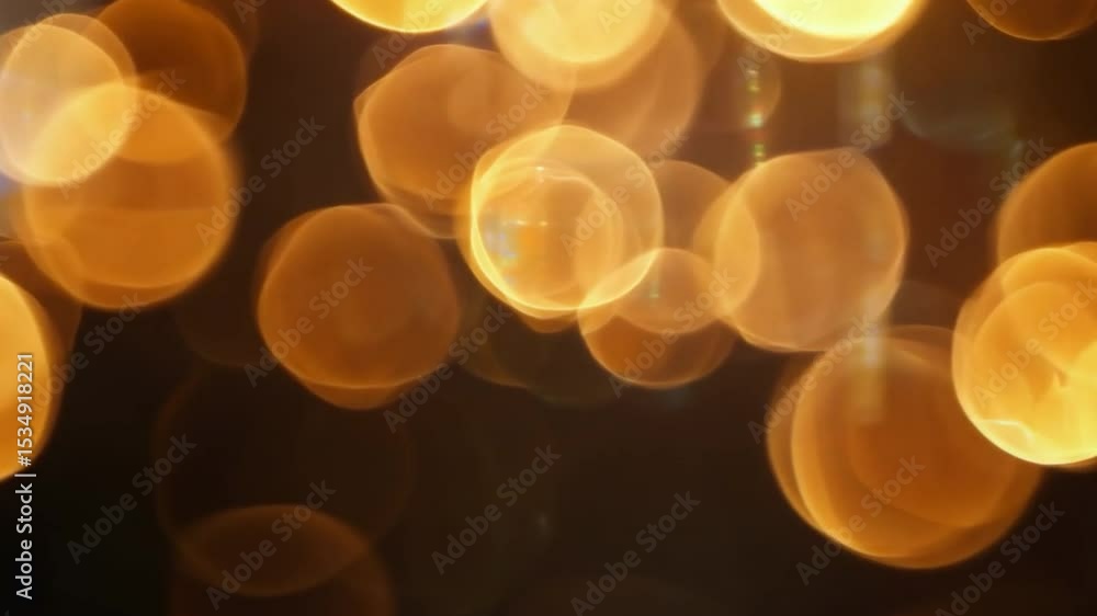 Poster abstract golden lights in a dark background creating a bokeh effect with soft glowing orbs and a dre