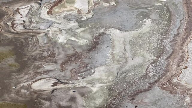 Aerial Great Salt Lake sand mud shore birds overhead 1. Largest saltwater lake in the Western Hemisphere. Solar evaporation ponds produce salt, potassium, magnesium. Recreation and industry.