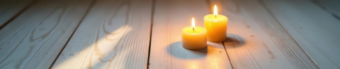 Two burning candles cast shadows on white hardwood , burning, closeup, intrigue