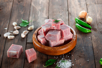 Frozen raw veal meat cubes.