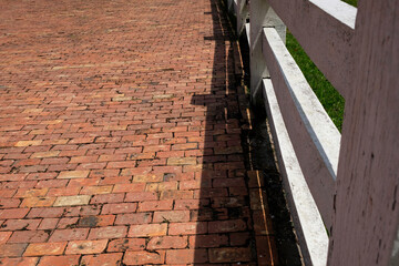 Red brick paving stones on a sidewalk